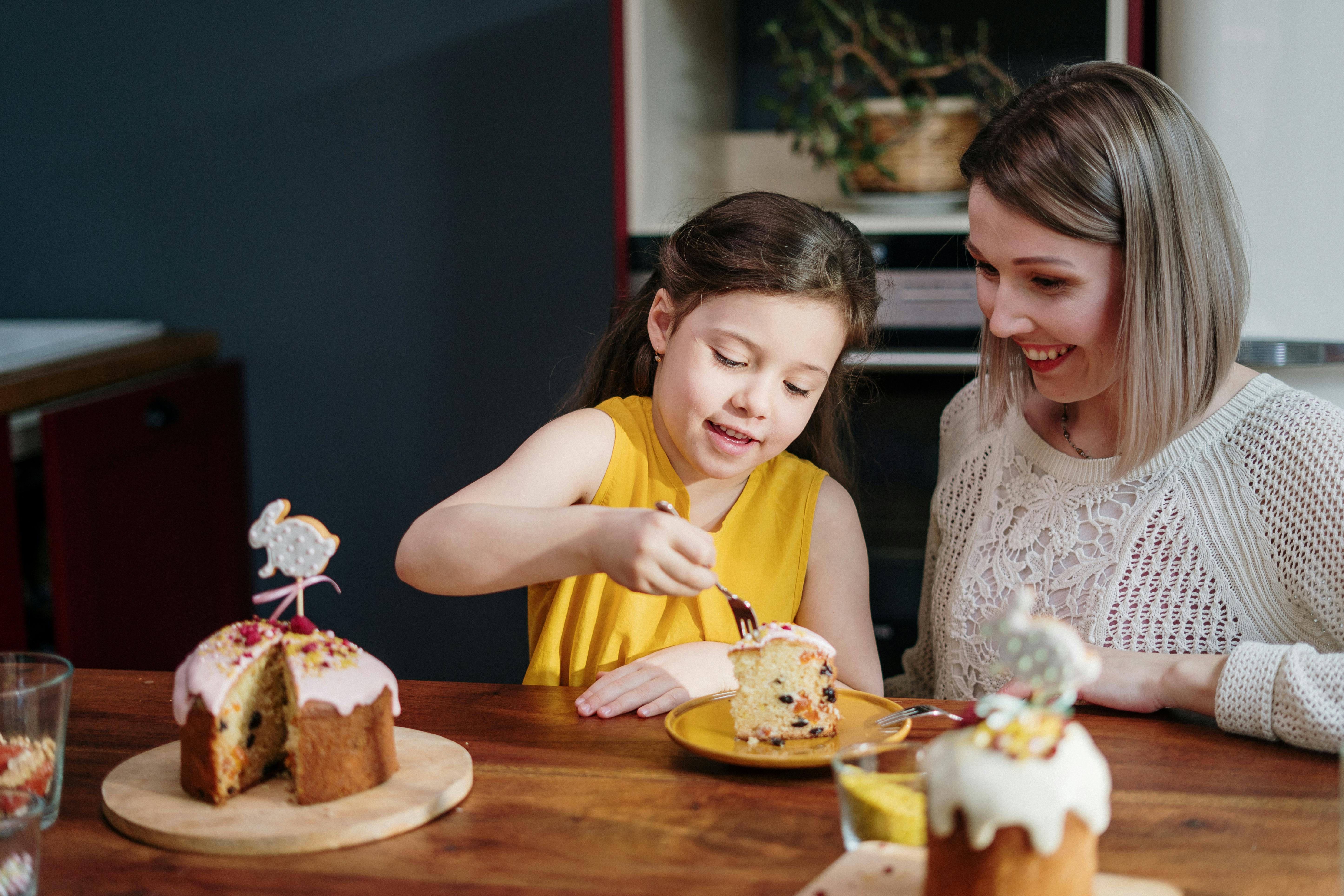 adults and children eating cake