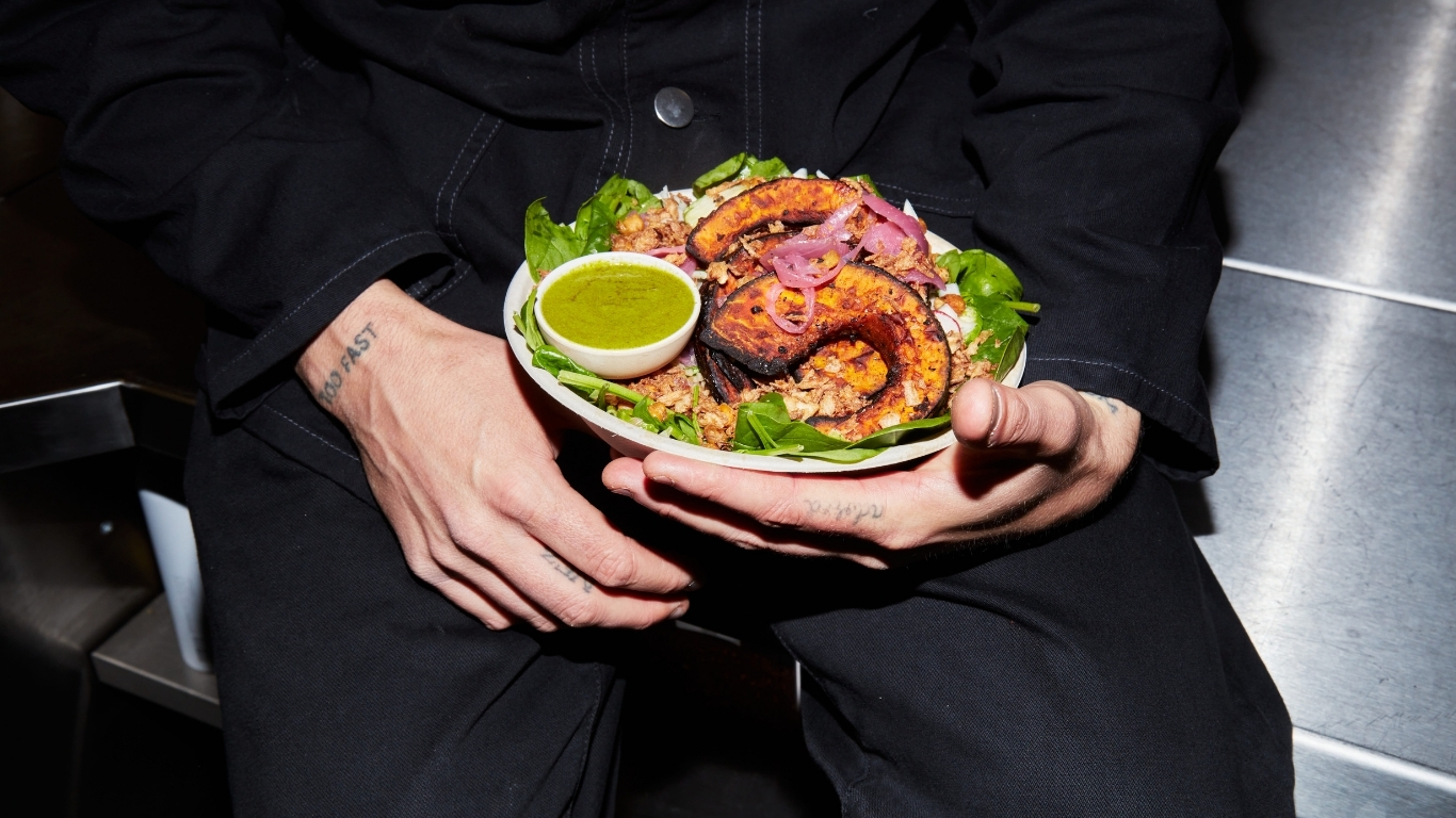 person holding a salad bowl