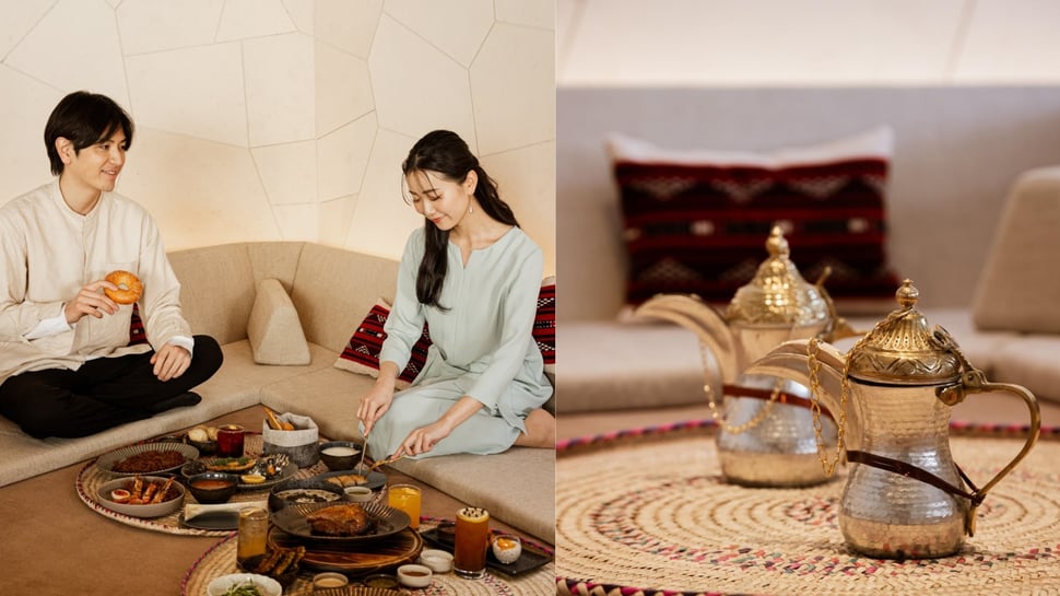 Guests enjoying Saudi cuisine and Arabic coffee in a traditional setting.