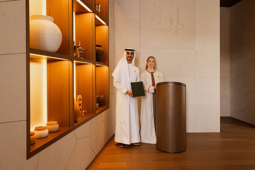Irth Restaurant and Café hosts in traditional uniform with Saudi visual display at Expo 2025 Osaka