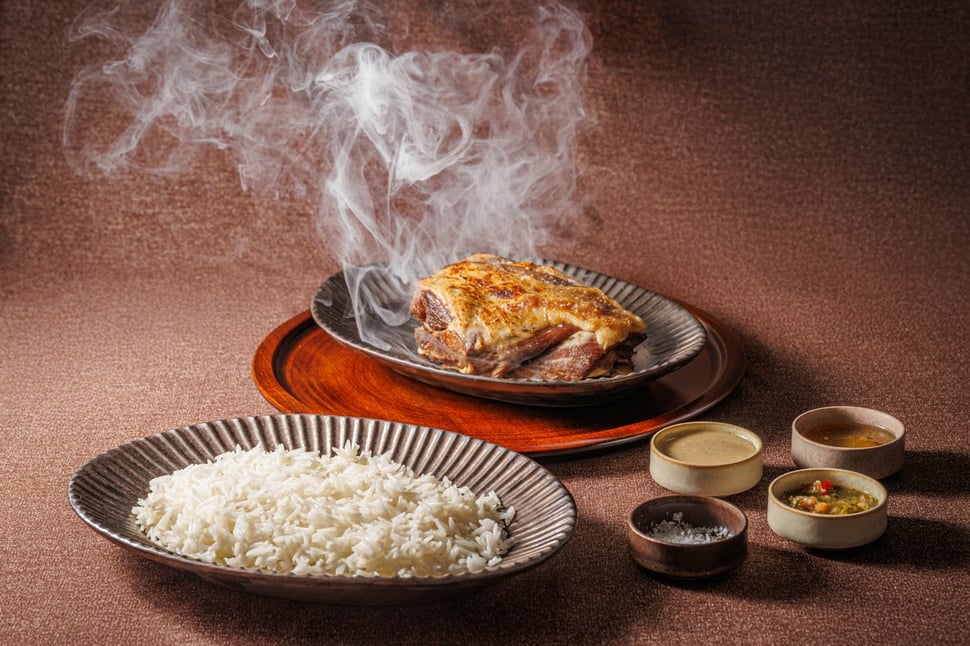 Smoked lamb with rice and condiments served at Irth Restaurant