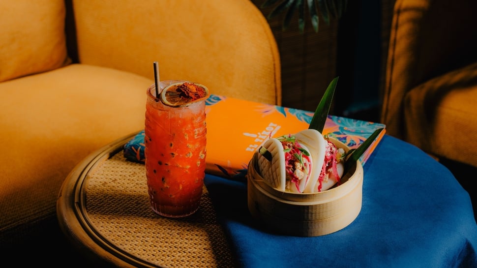 Tropical cocktail and bao buns in a modern casual dining setup