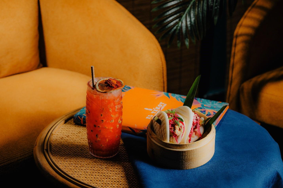 A drink and a bowl of food on a table
