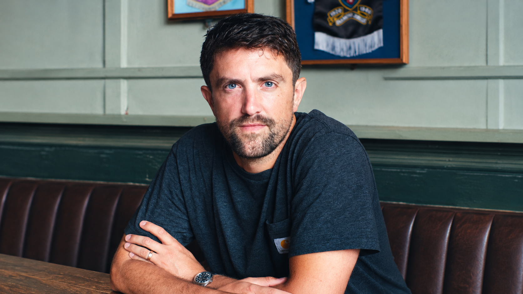 Man’s portrait in a pale green room