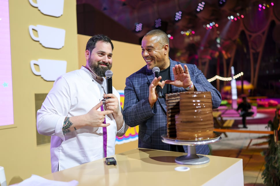 two people giving a talk at an event