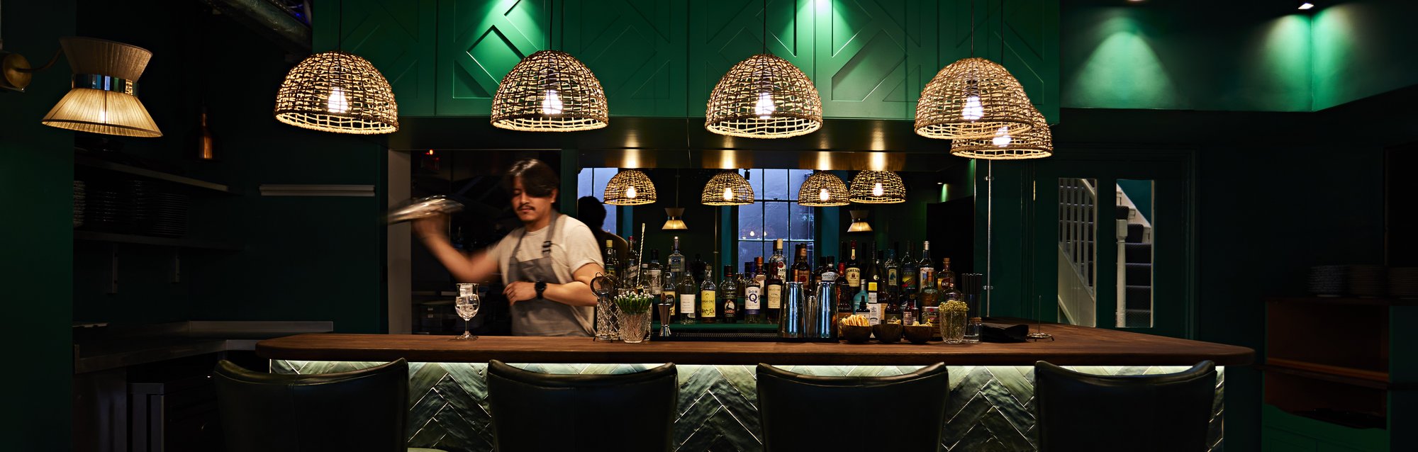 bartender making drinks at the bar