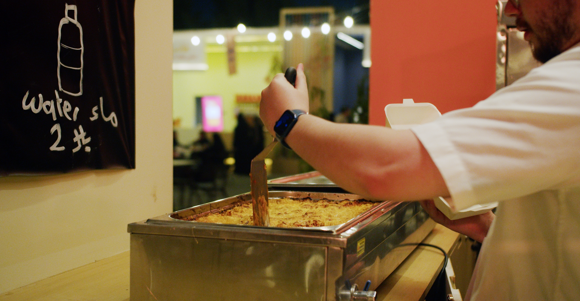 lasagna being cut by chef