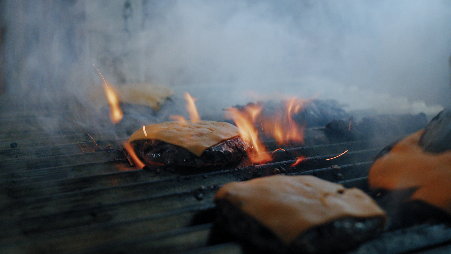 Burger cooking on bbq