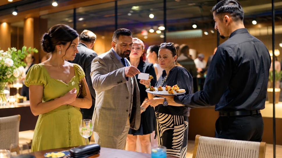 Warm hospitality event with serving tray