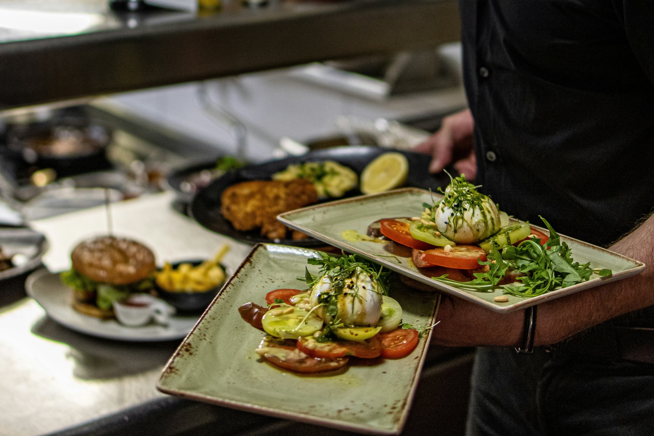 plated food carried by waiter