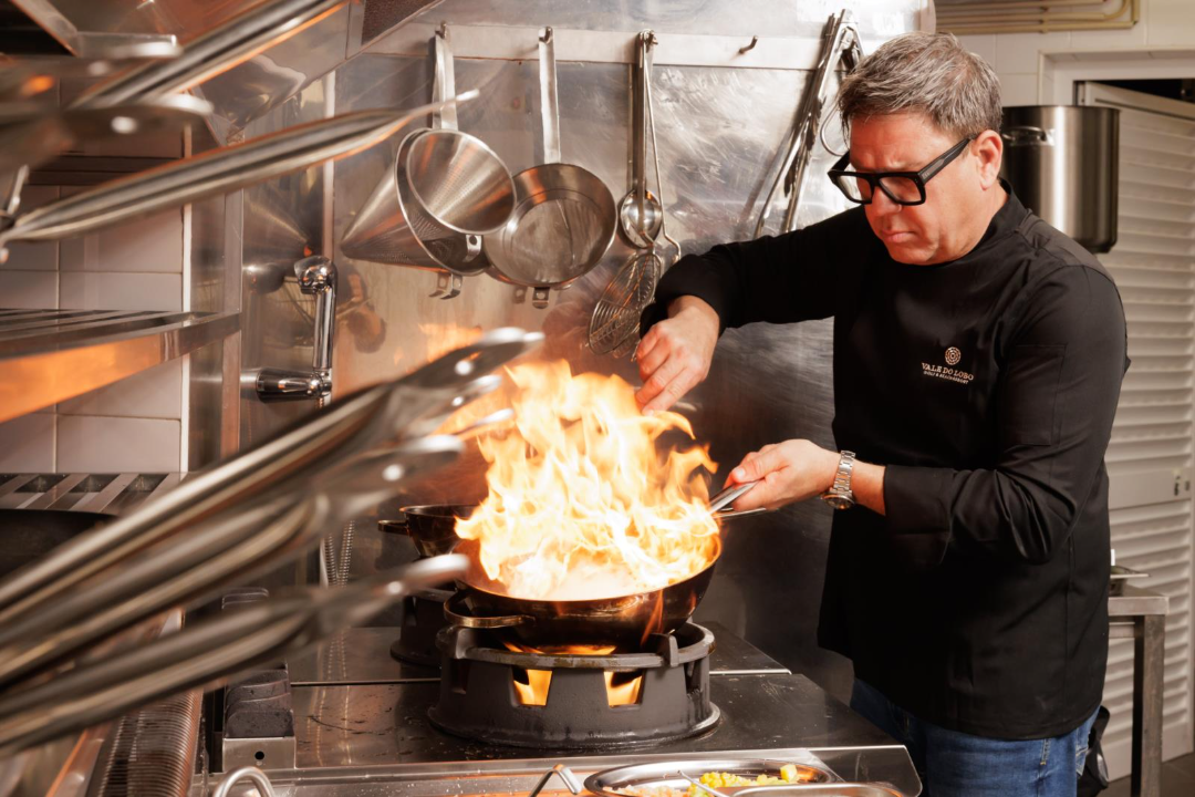 chef in kitchen cooking