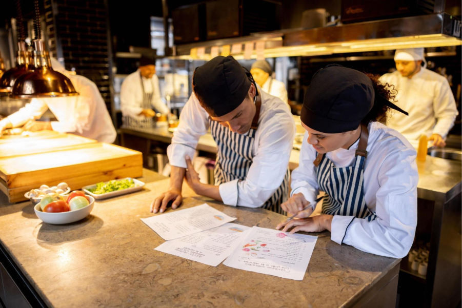 chefs looking at menus