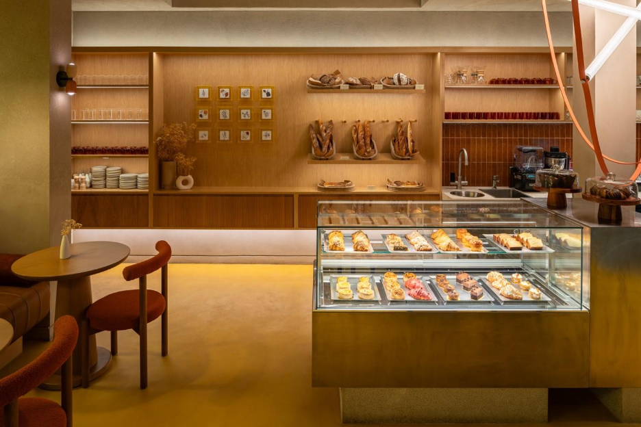 A bakery with a counter and a table

AI-generated content may be incorrect.